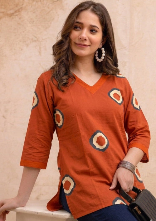 Orange Circular Print Pure Cotton Short Kurti.