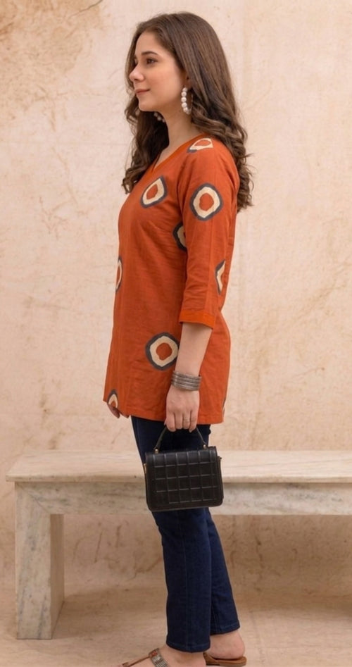 Orange Circular Print Pure Cotton Short Kurti.