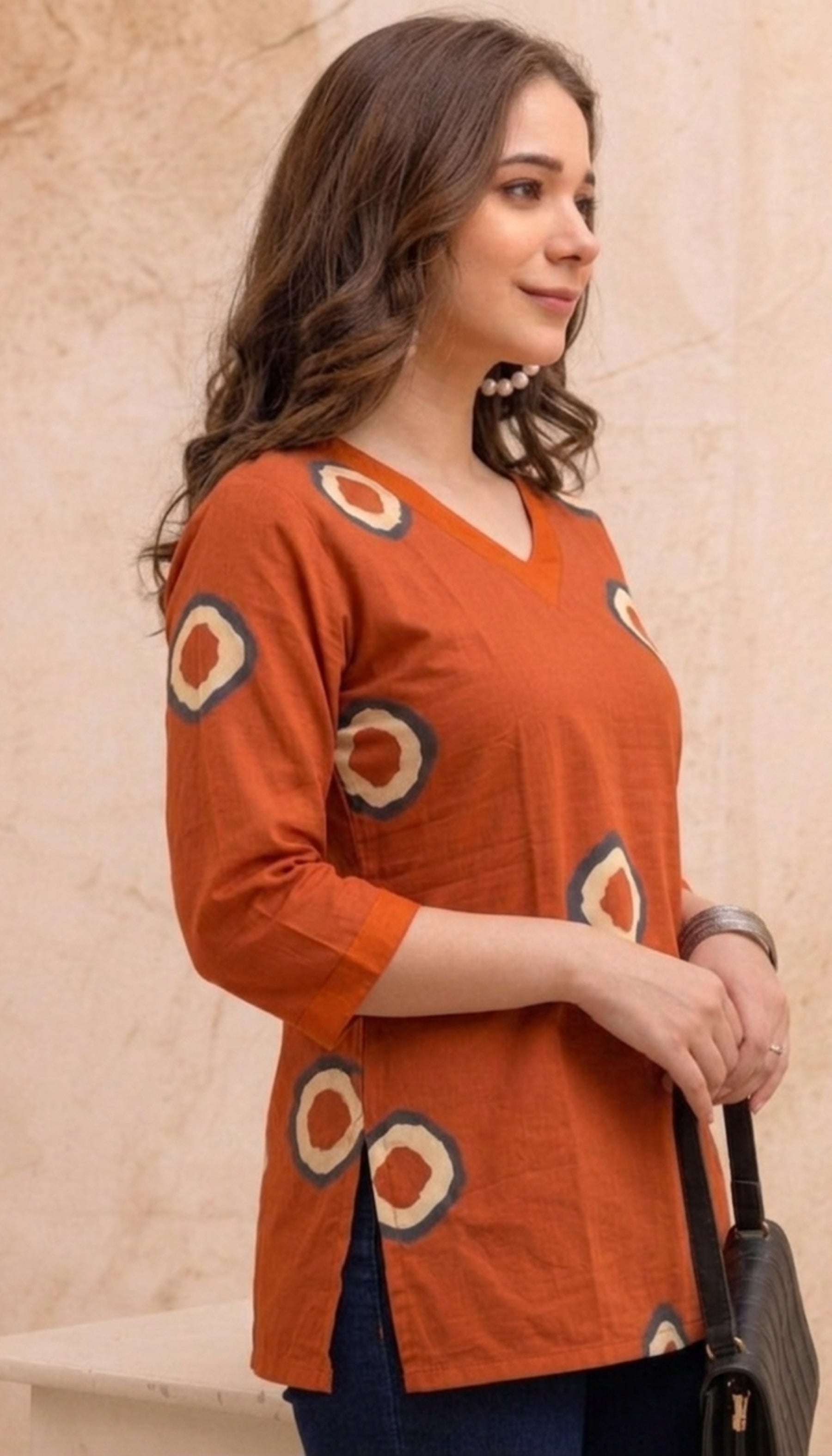 Orange Circular Print Pure Cotton Short Kurti.