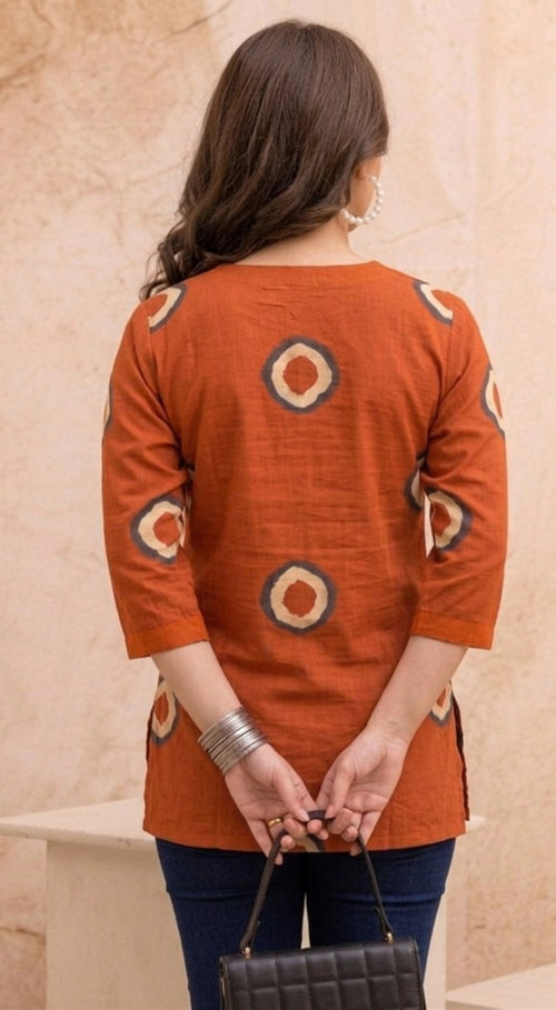Orange Circular Print Pure Cotton Short Kurti.