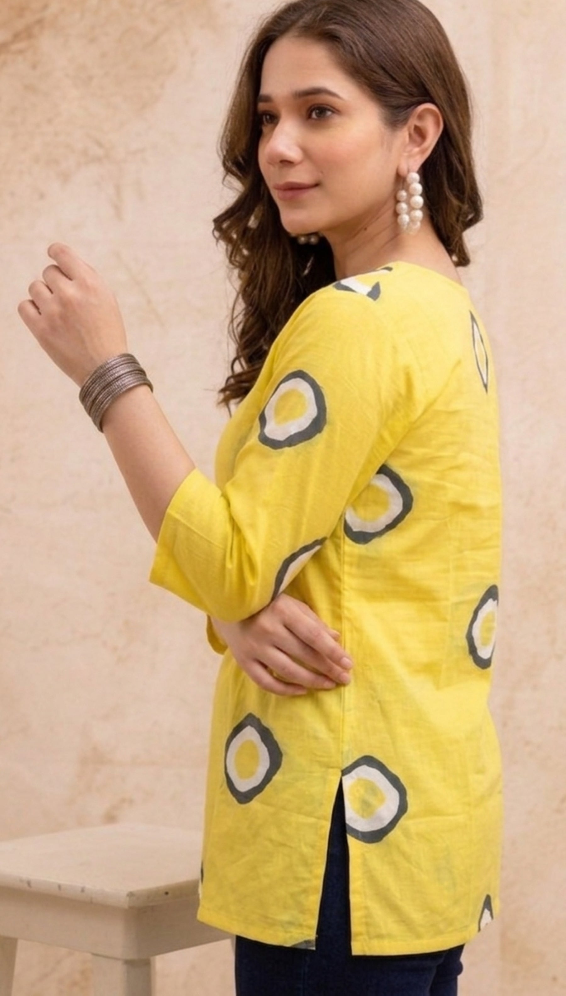 Yellow Circular Printed Pure Cotton Short Kurti.