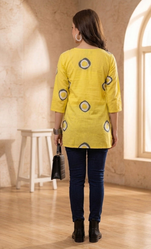 Yellow Circular Printed Pure Cotton Short Kurti.