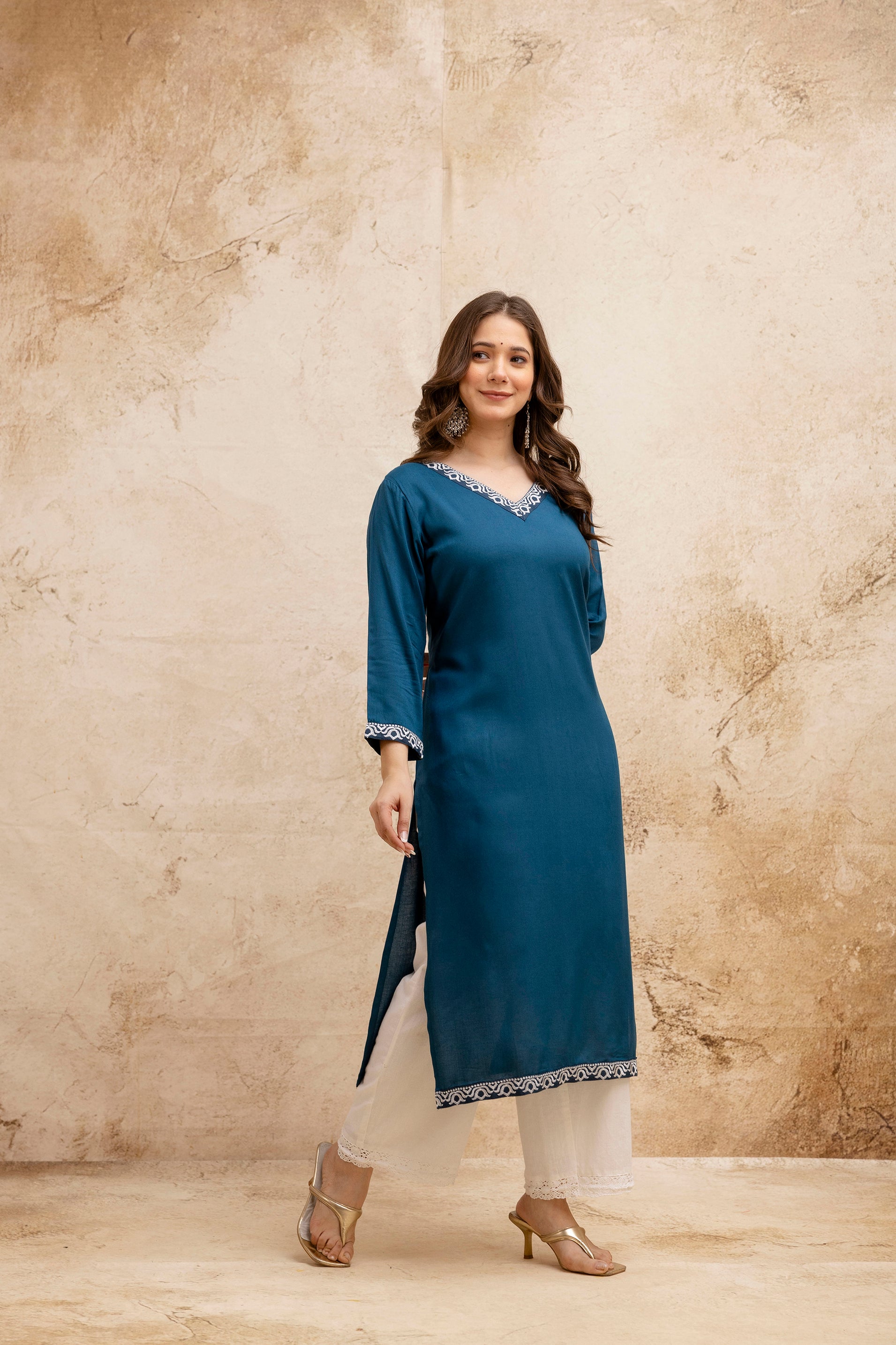 Teal Solid Embroidered Straight Kurta.