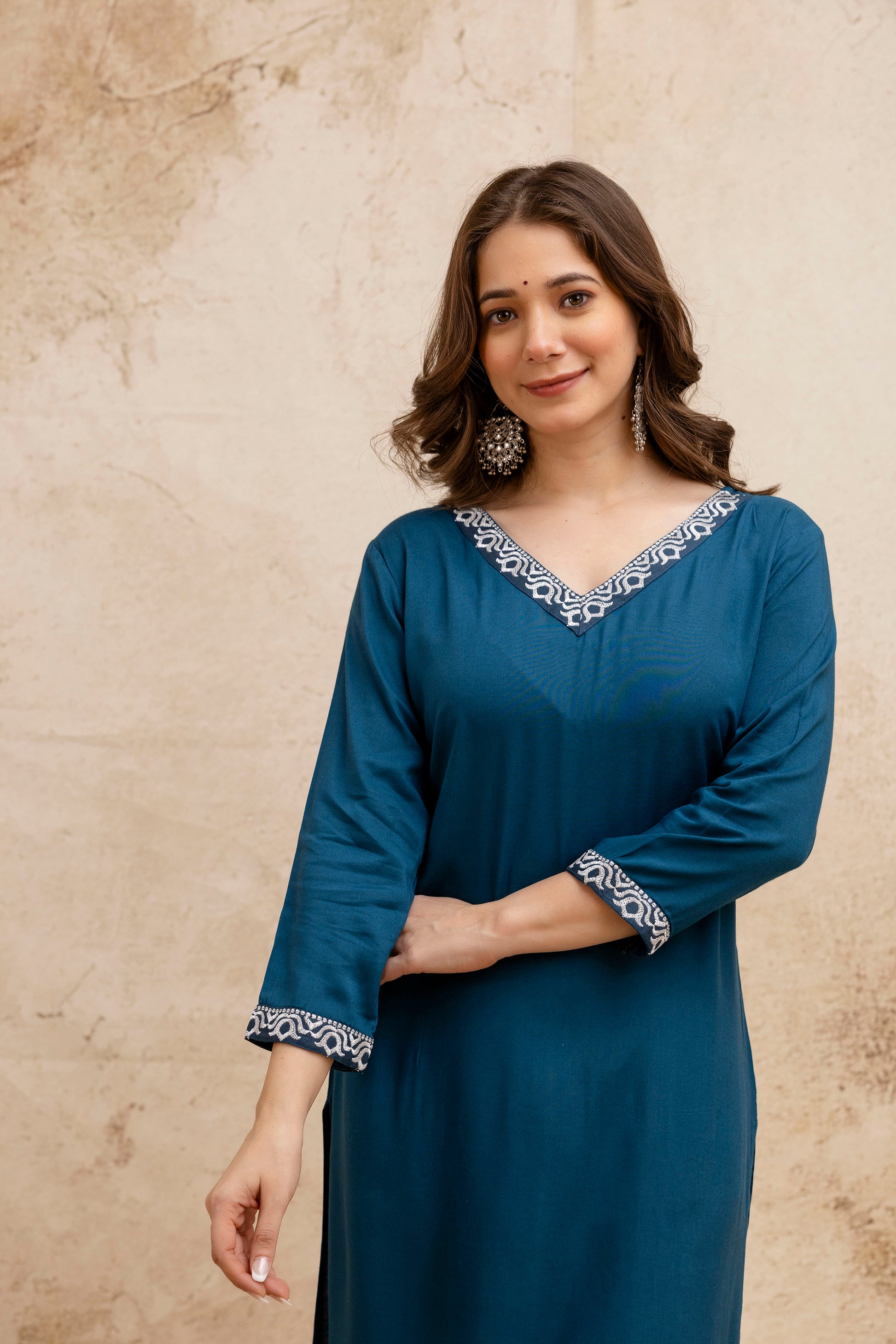 Teal Solid Embroidered Straight Kurta.