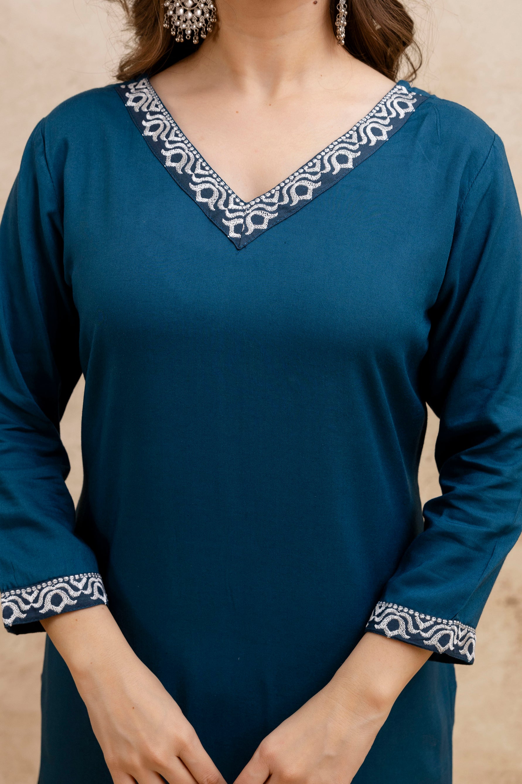 Teal Solid Embroidered Straight Kurta.
