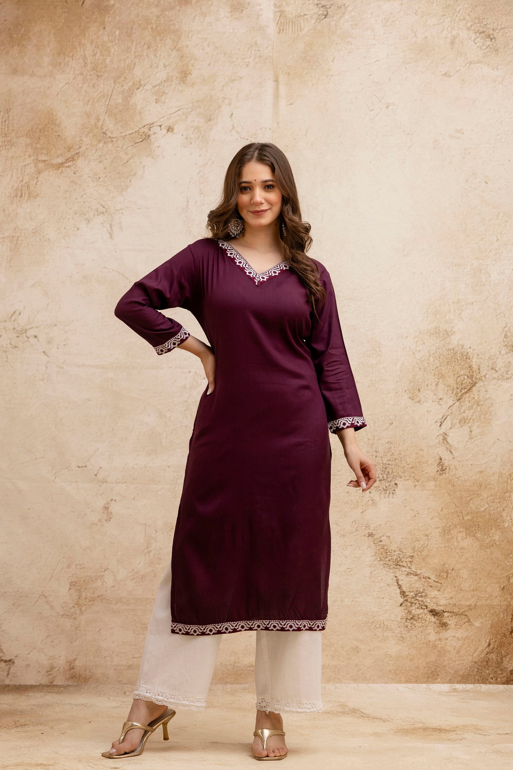Maroon Solid Embroidered Straight Kurta.