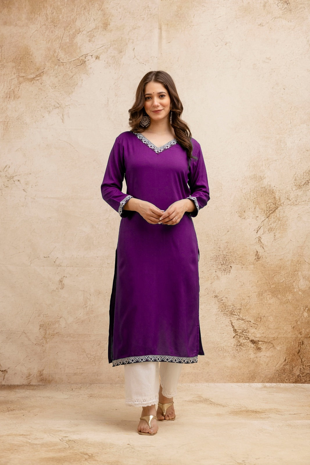 Purple Solid Embroidered Straight Kurta.