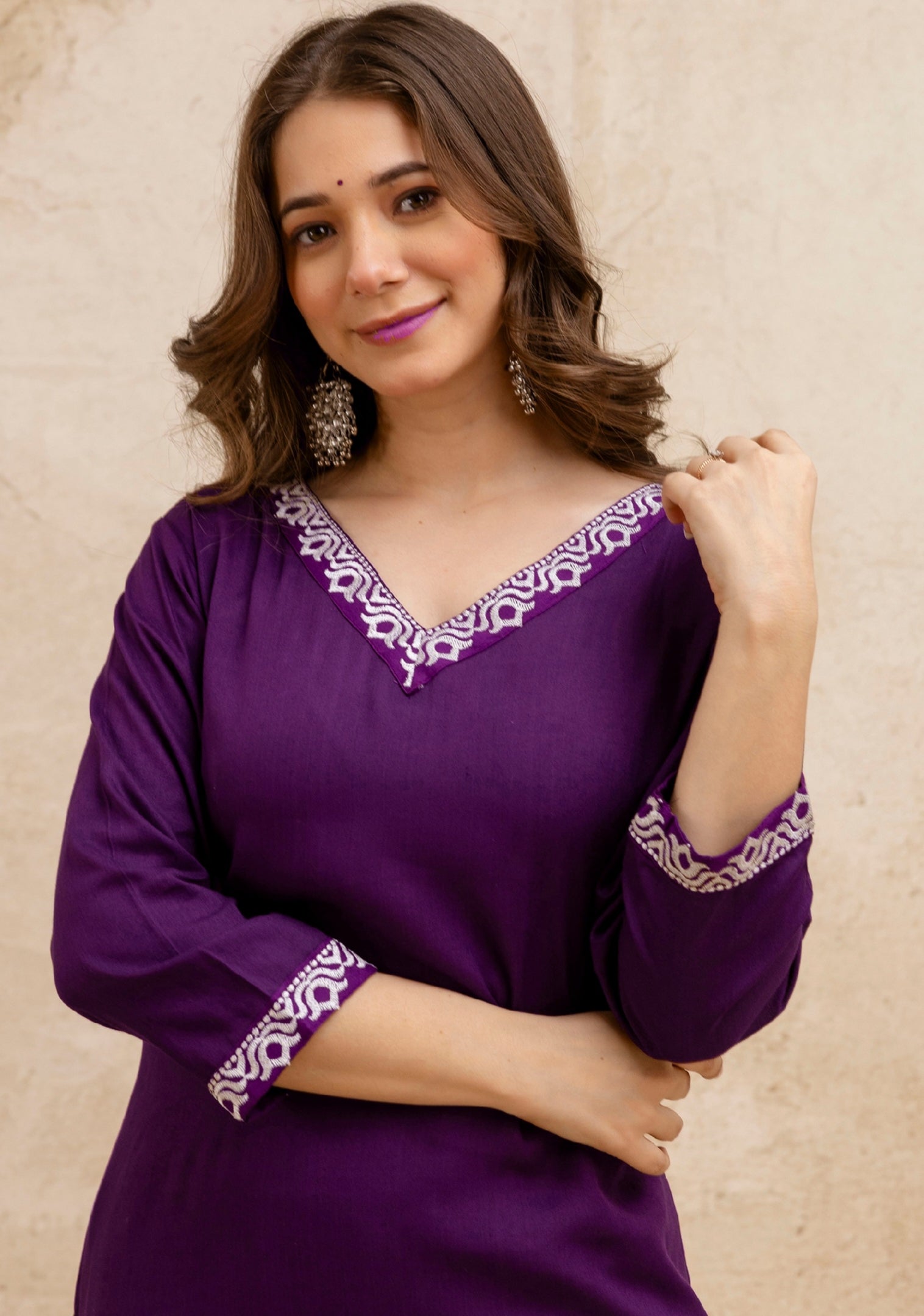 Purple Solid Embroidered Straight Kurta.