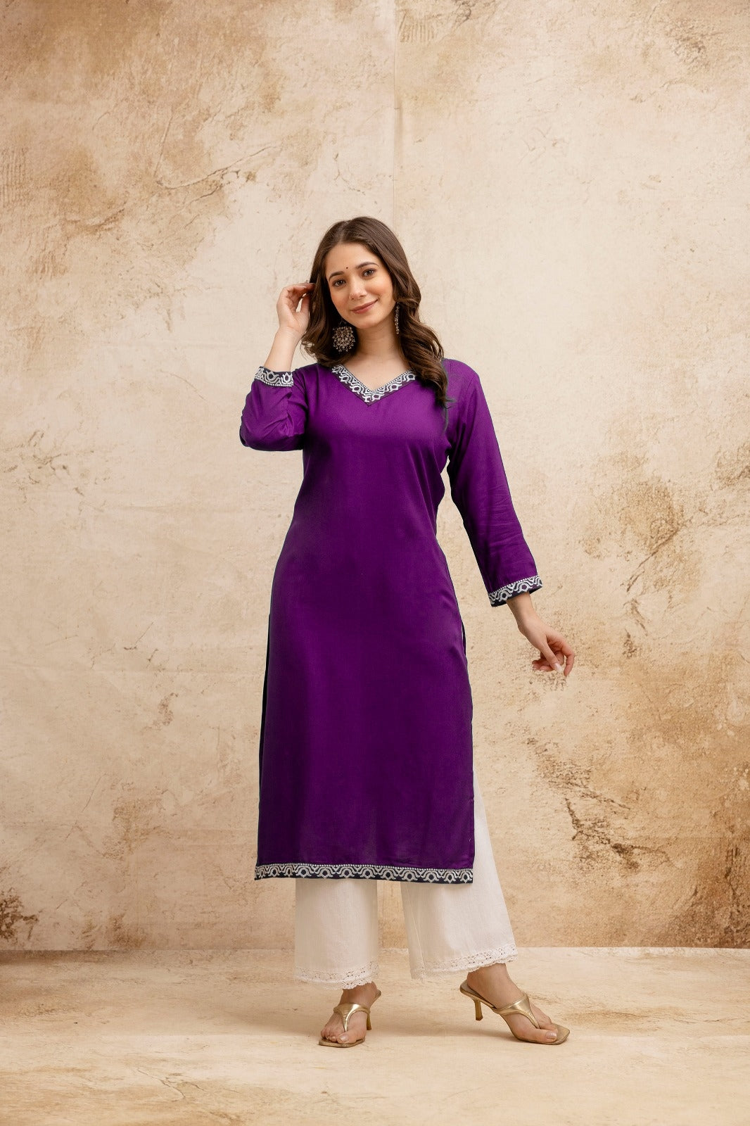 Purple Solid Embroidered Straight Kurta.