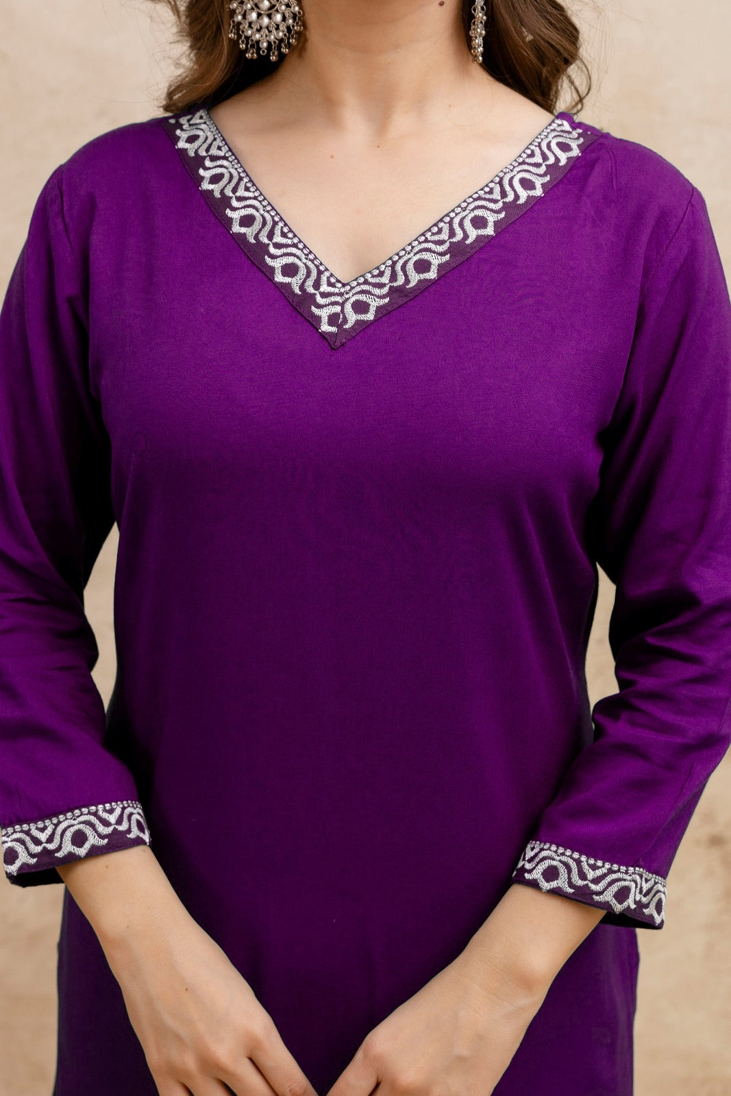 Purple Solid Embroidered Straight Kurta.